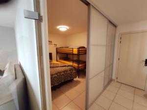 a bedroom with a bed and a door to a room at Sea-LeVel in Ostend