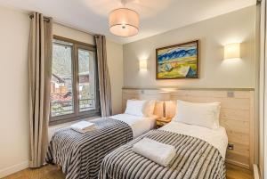 Posteľ alebo postele v izbe v ubytovaní White Pearl A13 - Alpes Travel - Central Chamonix (Sleeps 6)
