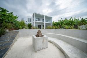 a house on top of a concrete wall at OceanView Villa Manzini with Private Pool ZanzibarHouses in Kiwengwa