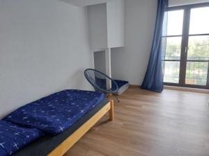 Ένα ή περισσότερα κρεβάτια σε δωμάτιο στο Dorfidyll