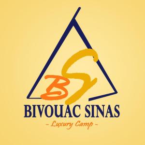 an image of a pyramid with a sign and the s logo at BIVOUAC SINAS in Rissani