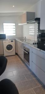 Kuchyň nebo kuchyňský kout v ubytování Au Panorama F3 2 chbres