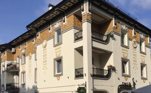 a building with balconies on the side of it at Eney Budget in Lviv