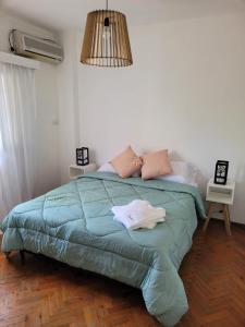 En eller flere senge i et værelse på Casa Oliva B & B