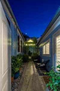 a pathway between two houses at night at Studio Blue in Key West
