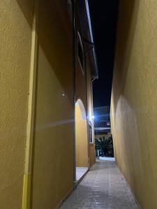 an empty hallway of a building at night at Sobrado lindo em Itú a 5 minutos do Centro ! in Itu