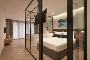 A bed or beds in a room at Hestia - Dimitressa 4