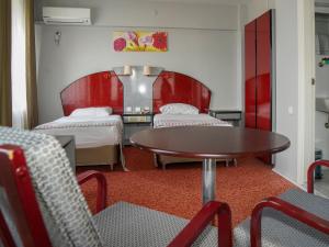 Ένα ή περισσότερα κρεβάτια σε δωμάτιο στο HOTEL EKEN