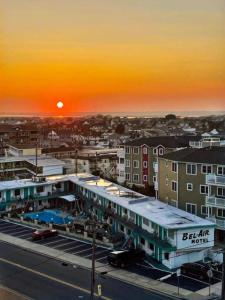 a view of a building with the sunset in the background at Bel Air Motel in Wildwood Crest