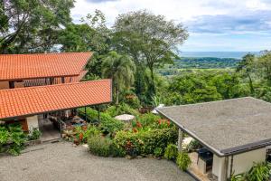 an aerial view of a house with a garden at Terrazas de Ballena in Uvita