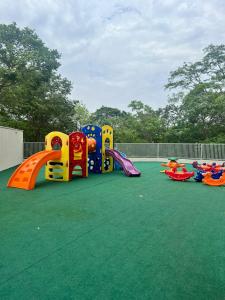 a playground with several different types of play equipment at Flat Super Luxo - Rio Quente - Acesso Ao Rio in Rio Quente