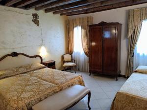 Voodi või voodid majutusasutuse Hotel Scandinavia - Relais toas