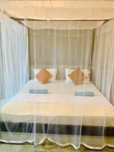 Letto o letti in una camera di Mango Tree House