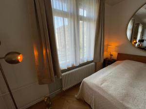 Voodi või voodid majutusasutuse Exclusive one room apartment next to Zürich main station toas