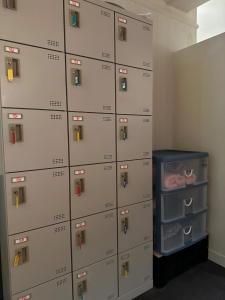 a bunch of lockers in a room at Guest House Tosa Otesujihana - Vacation STAY 14359 in Kochi