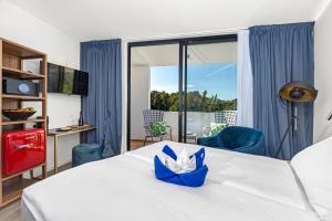 Postel nebo postele na pokoji v ubytování Resort Del Mar Emotion
