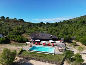 an aerial view of a house with a swimming pool at Emeraude Lodge in Andilana