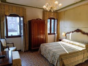 Voodi või voodid majutusasutuse Hotel Scandinavia - Relais toas