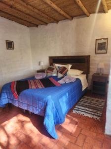Postelja oz. postelje v sobi nastanitve Cabaña Pimientos