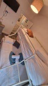a bunk bed in a room with two beds at Eyre Square Lane Budget Rooms in Galway