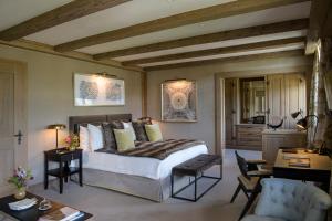 A bed or beds in a room at Gstaad Palace