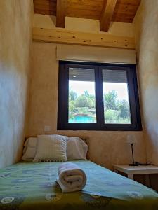 Łóżko lub łóżka w pokoju w obiekcie EL BALCÓN PANORÁMICO DE GREDOS
