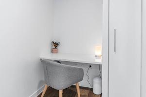 a white desk with a chair in a room at Bowen Hills 1 Bedroom Apartment in Brisbane