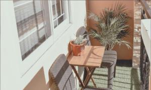 a small table and chairs on a balcony at AiPad Condo Rentals in Davao City