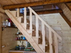 a wooden staircase in a tiny house at Eko katun Mirac in Danilovgrad