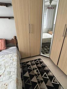 Cama ou camas em um quarto em Apto no centro de Bertioga