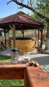 a wooden table with a bowl on top of it at Lenilla Guesthouse in Şiclod