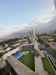 an aerial view of a city with a park at Dpto con hermosa vista al hipódromo de Monterrico in Lima