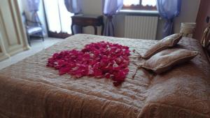 Posteľ alebo postele v izbe v ubytovaní LA CASA DEI MASUE'