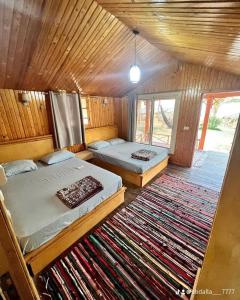 A bed or beds in a room at Big Dune camp