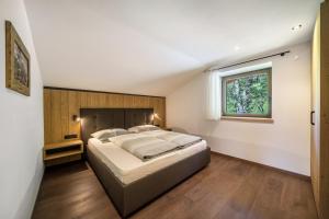Postel nebo postele na pokoji v ubytování Sunnseitn Lodge Apt Mountainsuite