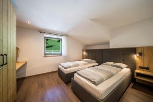 Postel nebo postele na pokoji v ubytování Sunnseitn Lodge Apt Mountainsuite