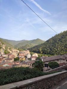 a view of a town with mountains in the background at La Loggia Sul Nera in Arrone