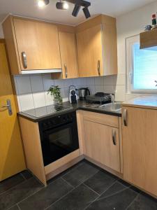 A kitchen or kitchenette at Appartement chalet avec une vue panoramique l'endroit idéal pour se ressourcer