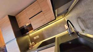 a kitchen with a sink and a counter top at Alpine House in Sauze dʼOulx