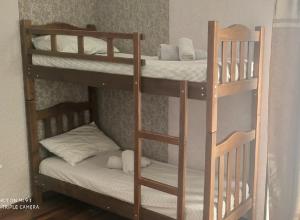 a couple of bunk beds in a room at Tirkius House in K'obulet'i