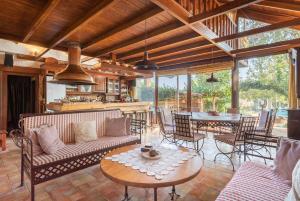 a living room with a couch and a table at Turdus Merula Retreat in Nea Makri