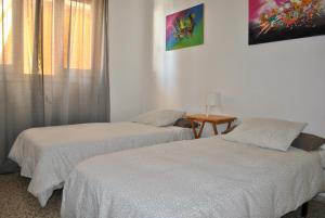 Cama o camas de una habitación en Apartamento Benicasim 1ª línea de playa