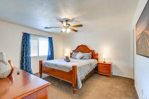 a bedroom with a bed and a ceiling fan at Bullhead City Home Less Than 2 Mi to Colorado River! in Bullhead City