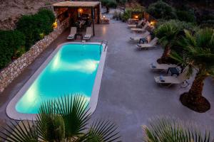 an overhead view of a swimming pool at a resort at Cicada 4 Bedroom Villa in Palaiokastro