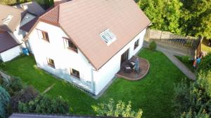 an overhead view of a white house with a roof at Dom Wakacyjny w Karkonoszach in Kowary