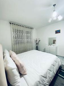Armand’s Home tesisinde bir odada yatak veya yataklar