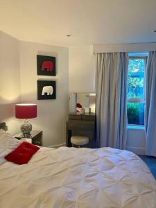 Ένα ή περισσότερα κρεβάτια σε δωμάτιο στο Lovely and spacious Wimbledon Flat