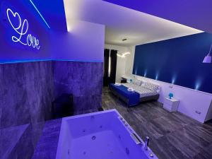a bathroom with a tub and a bed in a room at B&B Del Centro e SPA in Partinico +103 photos