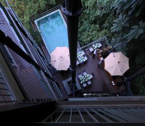an overhead view of a pool with tables and umbrellas at HIDE ELLA Hotel & Resort in Ella +30 photos