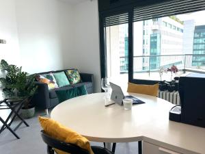 an office with a table with a laptop on it at Location in zona strategica- White House in Vimercate